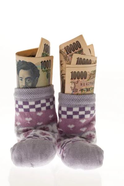 Children socks with japanese yen bills — Stock Fotó