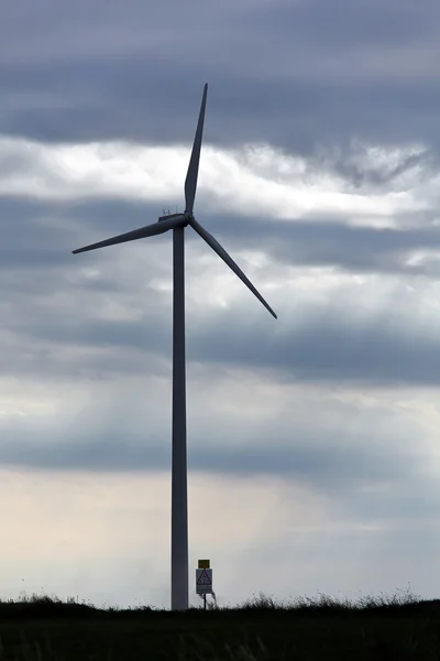 stock image Wind turbine in a wind park for energy alternative