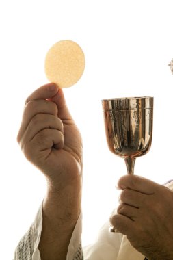 Catholic priest during communion in worship clipart