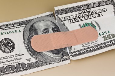 U.s. dollars banknotes with a band-aid clipart