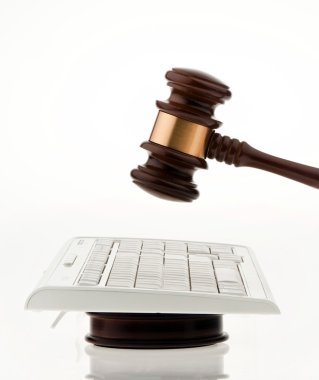 Gavel and keyboard. legal certainty on the interne clipart