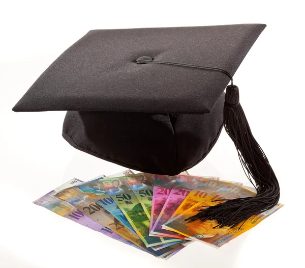Mortarboard and swiss francs. education costs. — Stock Photo, Image