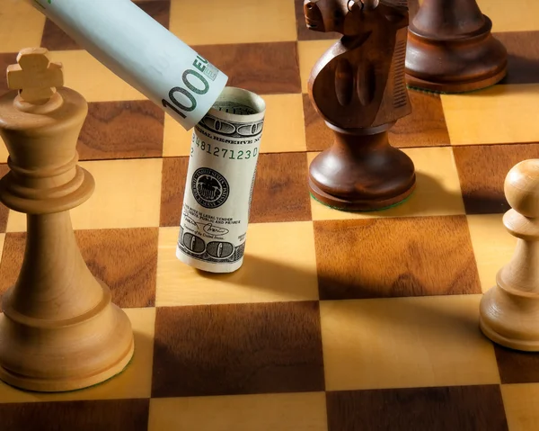 stock image Chess with dollar and euro bill. dollar depreciati