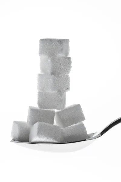 Много кусочков сахара для сладкого — стоковое фото