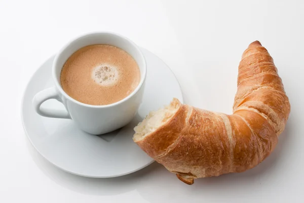 Croissants, pastries and coffee in a cup for break — Stock Photo, Image