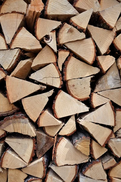 Stacked firewood on a pile of wood — Stock Photo, Image