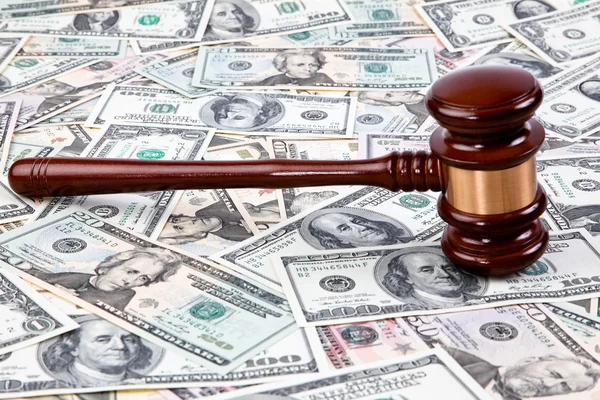 Dollar currency notes and gavel — Stock Photo, Image