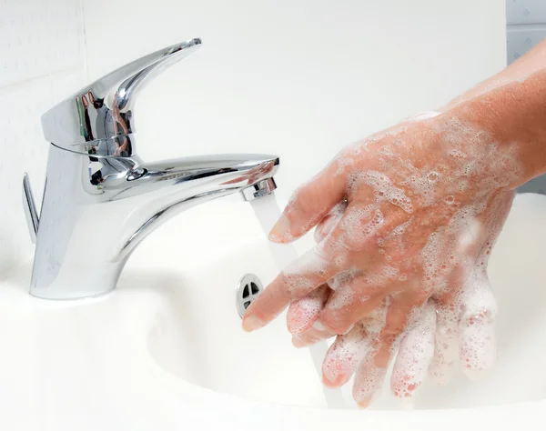 Händewaschen. neuer Schweinegrippe-Schutz hn1 lizenzfreie Stockbilder