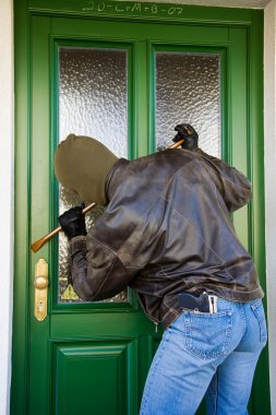 Burglar breaks into a residential building. clipart