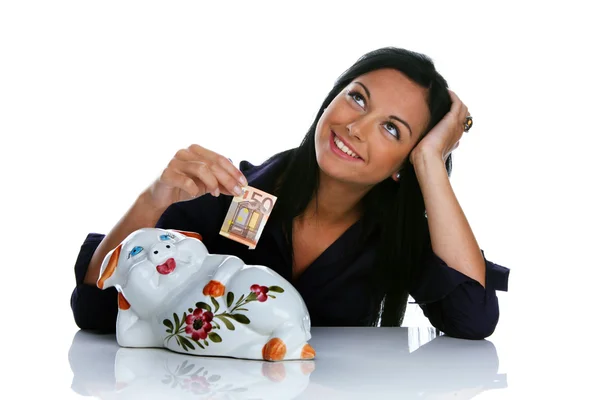 Jonge vrouw met piggy bank en eurobankbiljetten — Stockfoto