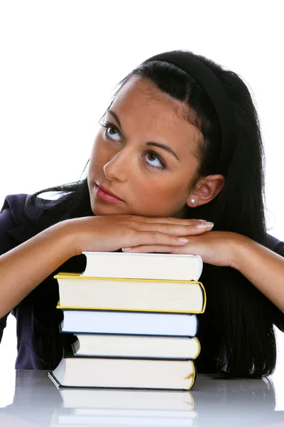Mladá žena s hromadou knih o učení — Stock fotografie