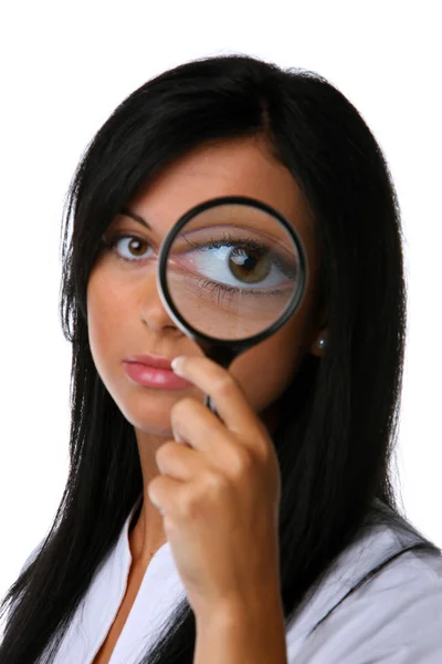 Woman with large eyes and a magnifying glass — Stock Photo, Image