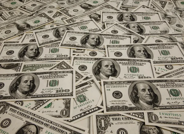 Högen av dollar sedlar för bakgrunder — Stockfoto