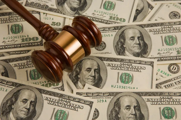 Law gavel on a stack of American money. — Stock Photo, Image