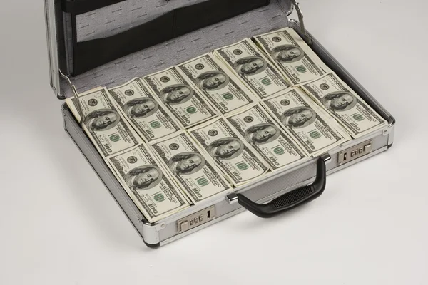 Briefcase full of cash — Stock Photo, Image