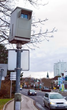 Red light camera at an intersection clipart