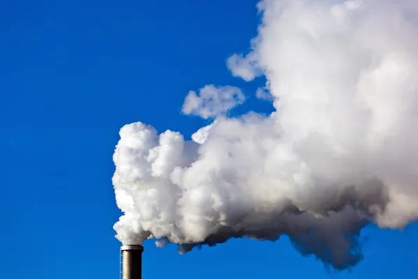 Smoking chimneys of a factory — Stock Photo, Image