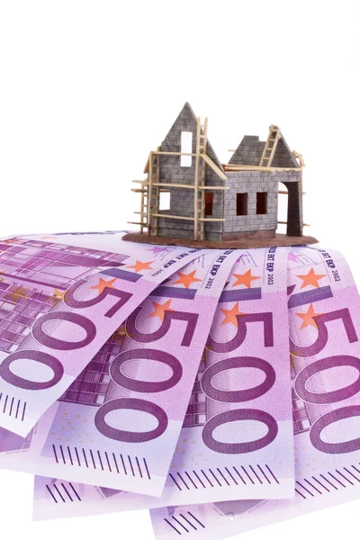 Euro banknotes and shell of a house — Stock Photo, Image