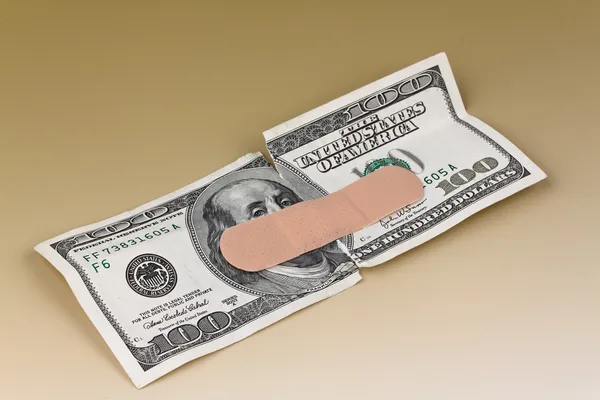 U.s. dollars banknotes with a band-aid — Stock Photo, Image