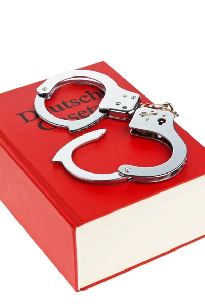 Gestzbuch and handcuffs — Stock Photo, Image