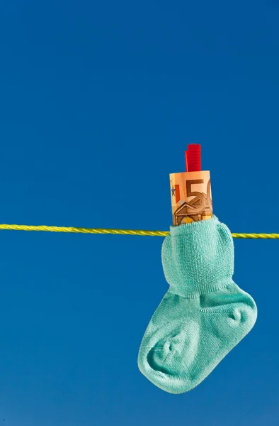 Baby socks on clothesline — Stock Photo, Image