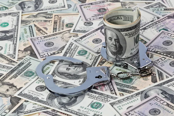 Dollars and handcuffs — Stock Photo, Image