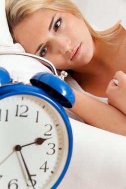 Clock with sleepless at night. clipart