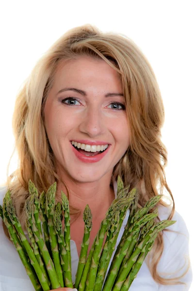 Vrouw met groene asperges — Stockfoto