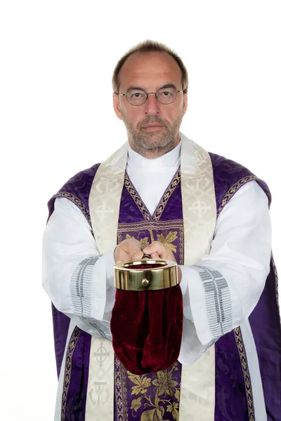 Catholic priest collects money — Stock Photo, Image