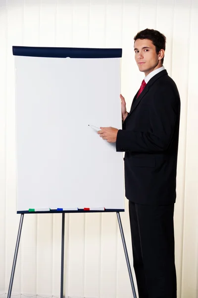 Businessman with a flip chart — Stock Photo, Image