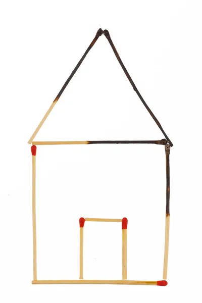 Burned house made of matches — Stock Image Burned house made of matches Royalty Free Stock Images