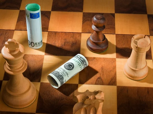 Chess with dollar and euro bill. — Stock Photo, Image