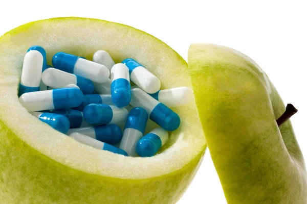 stock image Apple tablets with capsules.