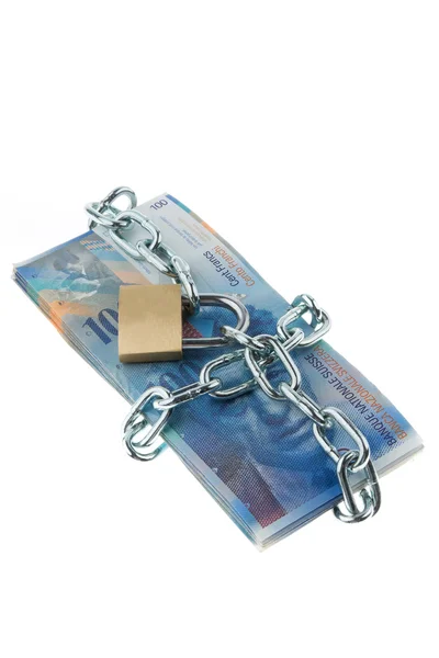 Swiss francs with a lock and chain. — Stock Photo, Image