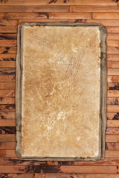 Faded old paper on wood — Stock Photo, Image