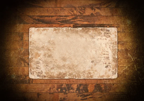 Old faded paper on wood — Stock Photo, Image