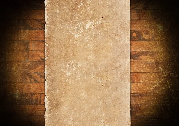 Old paper roll on a wooden background — Stock Photo, Image