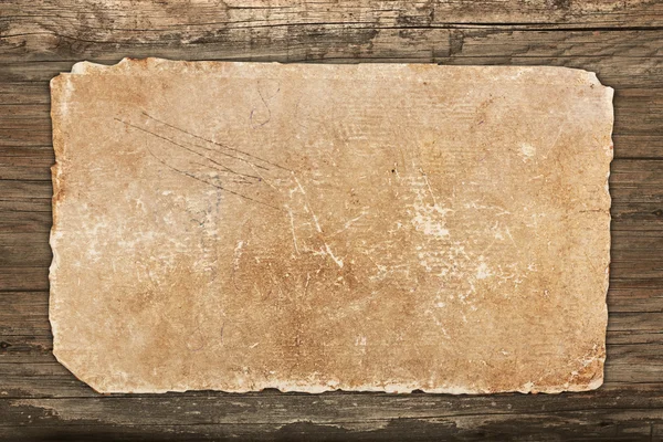 Papel en blanco vintage sobre fondo de madera — Foto de Stock