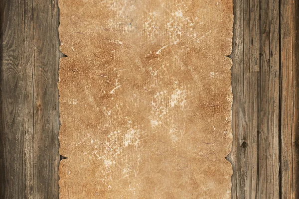 皱褪了色的纸卷上一个木制的背景 — 图库照片