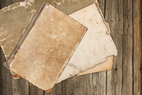 Old book and papers on a wooden background — Stock Photo, Image