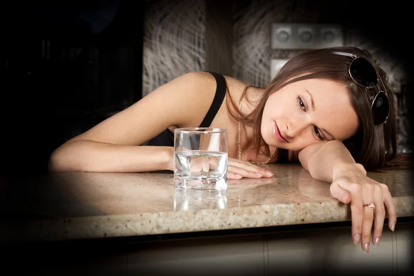 Beautiful drunk lady with a glass of vodka — Stock Photo, Image