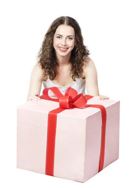 Beautiful girl smiling holds a gift in a box — Stock Photo, Image