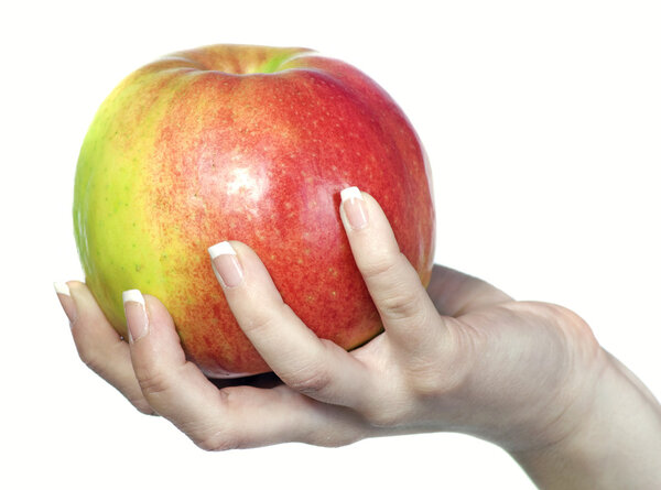 Ripe red apple in his hand on a white background
