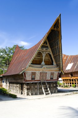 Traditional Batak house on the Samosir island clipart