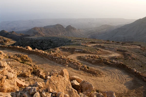 Una strada sterrata in montagna Oman Immagini Stock Royalty Free
