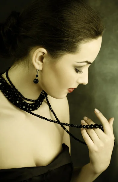 Beautiful woman with beads Stock Photo