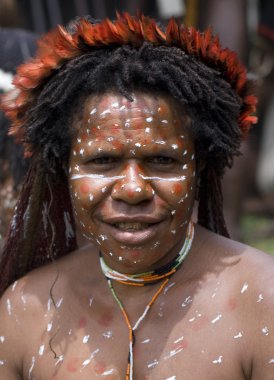 A traditional papua woman in a village near Wamena clipart