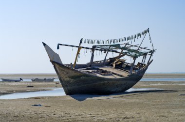 The old ship in the dried up sea clipart