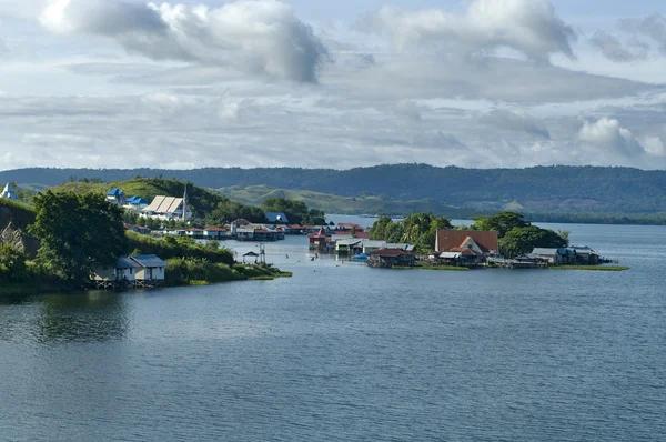 stock image Houses on an island on the lake Sentani