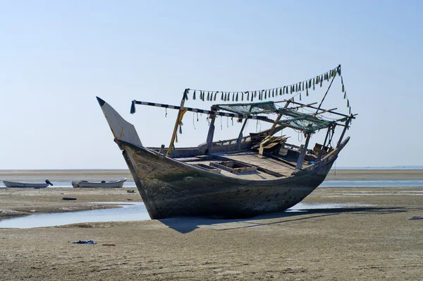 The old ship in the dried up sea Royalty Free Stock Images